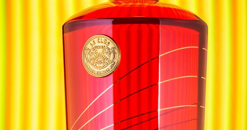 A bottle of Takamaka Rum featuring a gold diecast coin embellishment produced by Signet