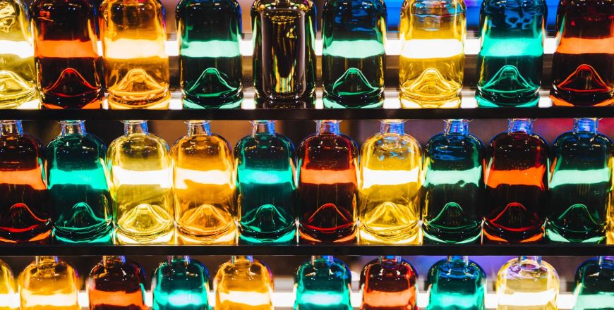 Backlit bar shelf with colour liquor or spirit bottles